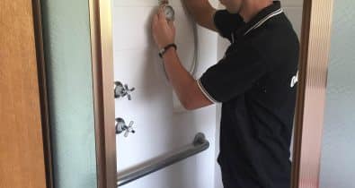 Water Tight Canberra plumber testing water pressure from the shower